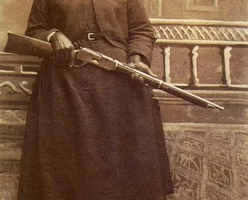 Stagecoach Mary Fields holding her shotgun standing next to her dog